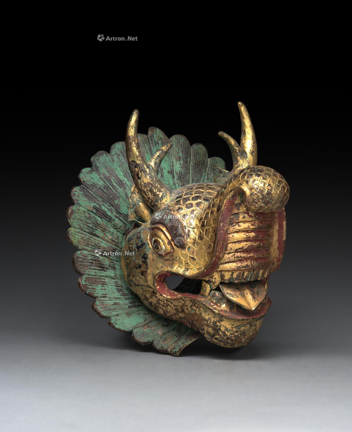 【西藏16世纪 铜鎏金锤迭神兽摩伽罗头】拍卖品